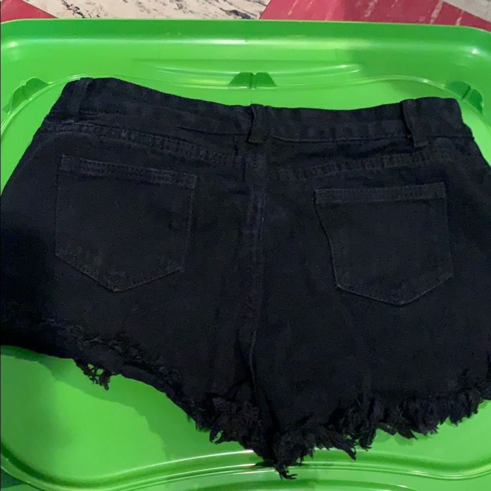 black ripped jean shorts